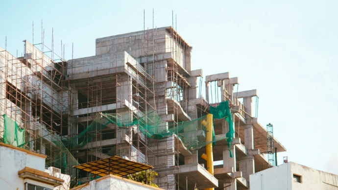 A building is under construction with scaffolding.